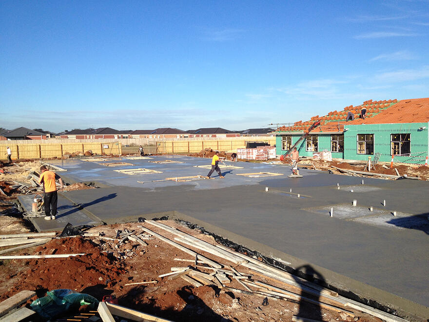 Concrete house slabs during construction House slab being poured on a new housing estate in Melbourne